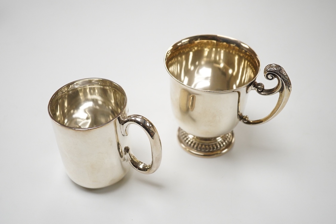 An Edwardian silver christening mug, wit engraved initials, Robinson & Co Ltd, London, 1907, height 99mm and one other smaller silver christening mug, James Dixon & Sons, Sheffield, 1907, 8.3oz.